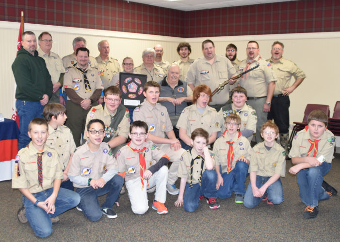 Courtesy Photo Longtime Scoutmaster Dennis Johnson is surrounded by other leaders and Scouts during a recent Court of Honor at which he received recognition.